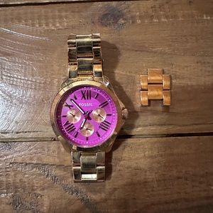 Pink faced fossil watch